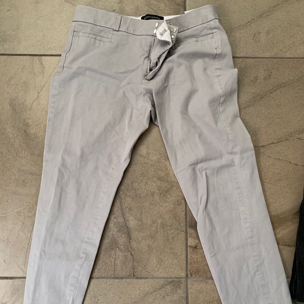 Grey cropped work pants.